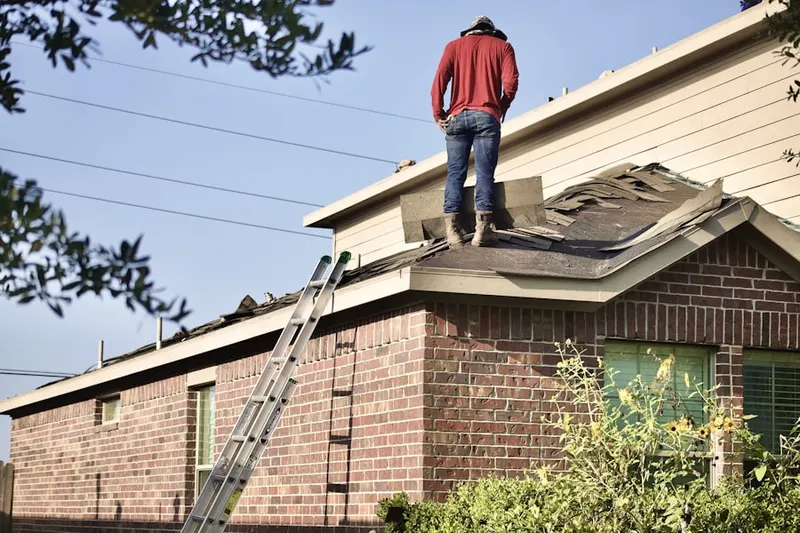 Professional roofer working on a residential roof in Downtown Austin